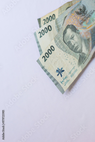 Indonesia October 13, 2024 6000 rupiah note in close up photo from top corner