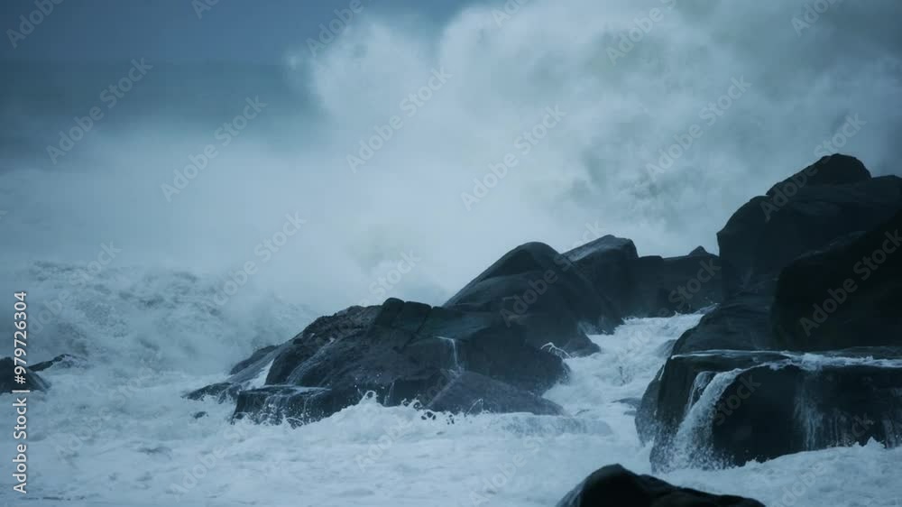 The sea wave hit the rocks, slow motion