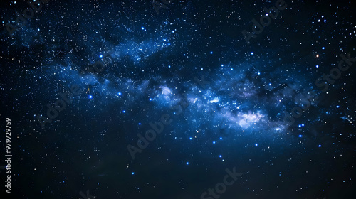 A Stunning Night Sky Displaying the Milky Way Galaxy with Bright Stars in a Dark Blue Background