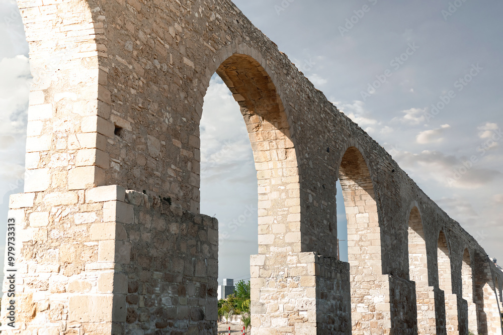 Kamares aqueduct standing tall under cloudy sky in Larnaca, Cyprus Kamares aqueduct standing tall under cloudy sky in Larnaca, Cyprus
