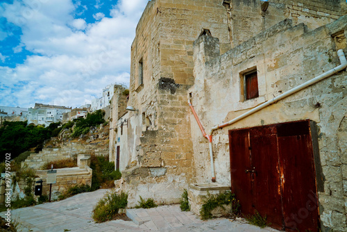 Il nucleo antico di Ginosa caratterizzato dalla gravina con antiche case e chiese rupestri, Taranto, Puglia, Italia photo