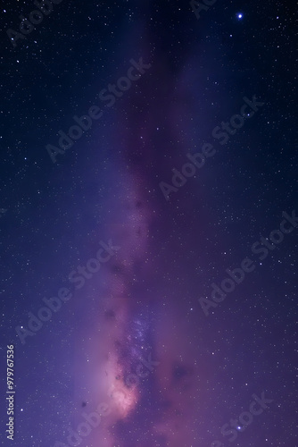 A stunning panoramic view of the Milky Way galaxy, showcasing a bright band of stars and cosmic dust stretching across the night sky. 