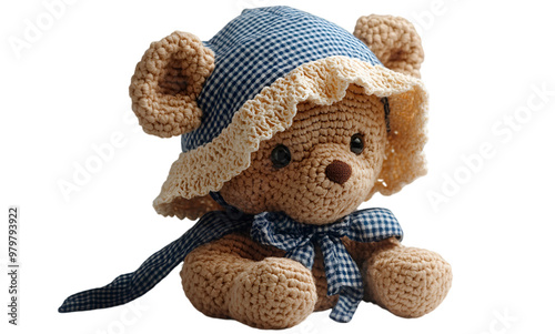 a stuffed teddy bear wearing a hat.  photo