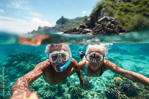 Senior couple snorkeling in clear tropical waters