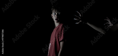 Creative image of a boy in the dark