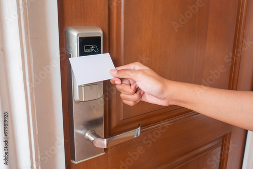 open smart door using card. female hand open the door.