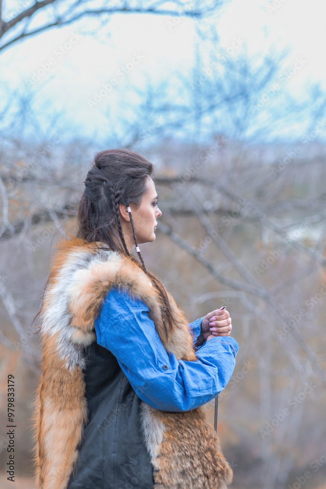 Viking warrior girl in blue in autumn Viking warrior girl in blue in autumn