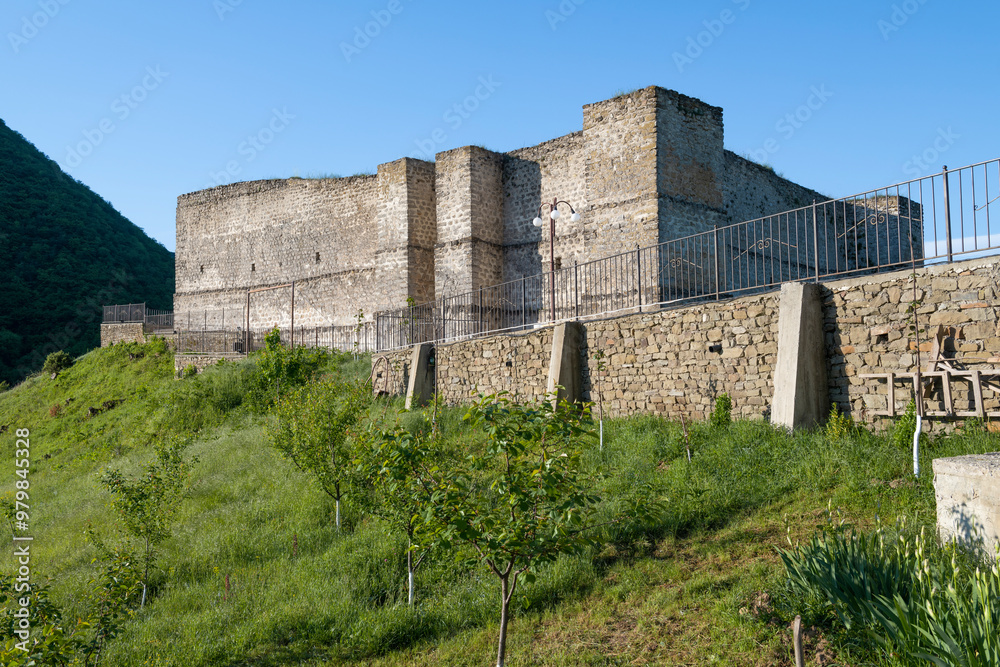 View of the ancient fortress of the Seven Brothers and One Sister on a sunny May morning. Khuchni. Republic of Dagestan View of the ancient fortress of the Seven Brothers and One Sister on a sunny May morning. Khuchni. Republic of Dagestan