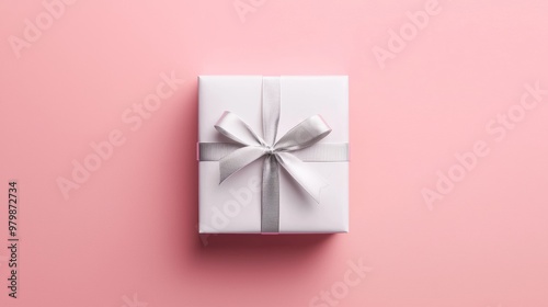 Minimalist Gift Box Wrapped in Matte White Paper on a Pink Background for Elegant Presentations