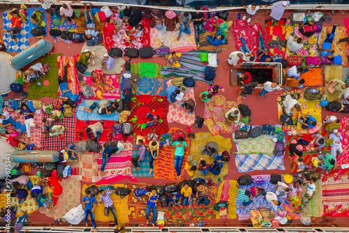 Aerial view of people taking passenger boats along the Burigaga river in Dhaka port, Keraniganj, Bangladesh. photo