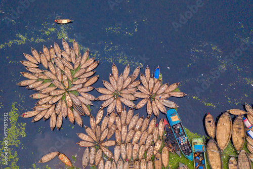 Aerial view of people taking passenger boats along the Burigaga river in Dhaka port, Keraniganj, Bangladesh. photo