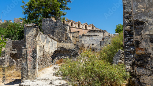 Abandoned Catholic church in abandoned town or village Kayakoy, neighbourhood of municipality and district of Fethiye, Mugla Province, Turkey photo