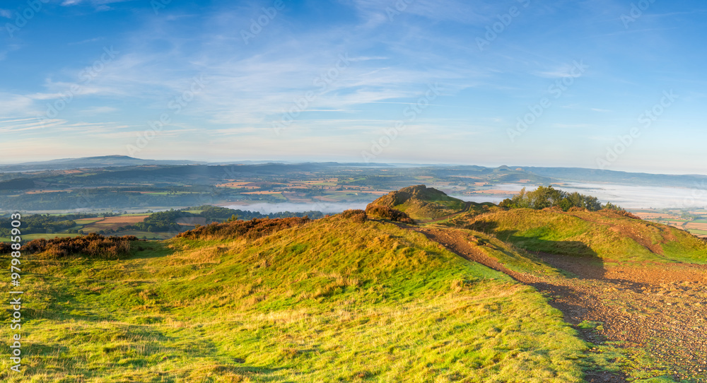 Naklejka premium A panoramic view from the top of the Wrekin Hill in Shropshire, UK looking south west towards Brown Clee hill and the Shropshire Hills