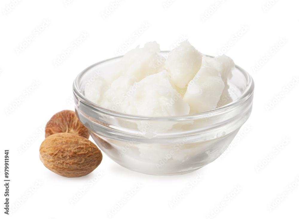 Shea butter in bowl and nuts isolated on white Shea butter in bowl and nuts isolated on white