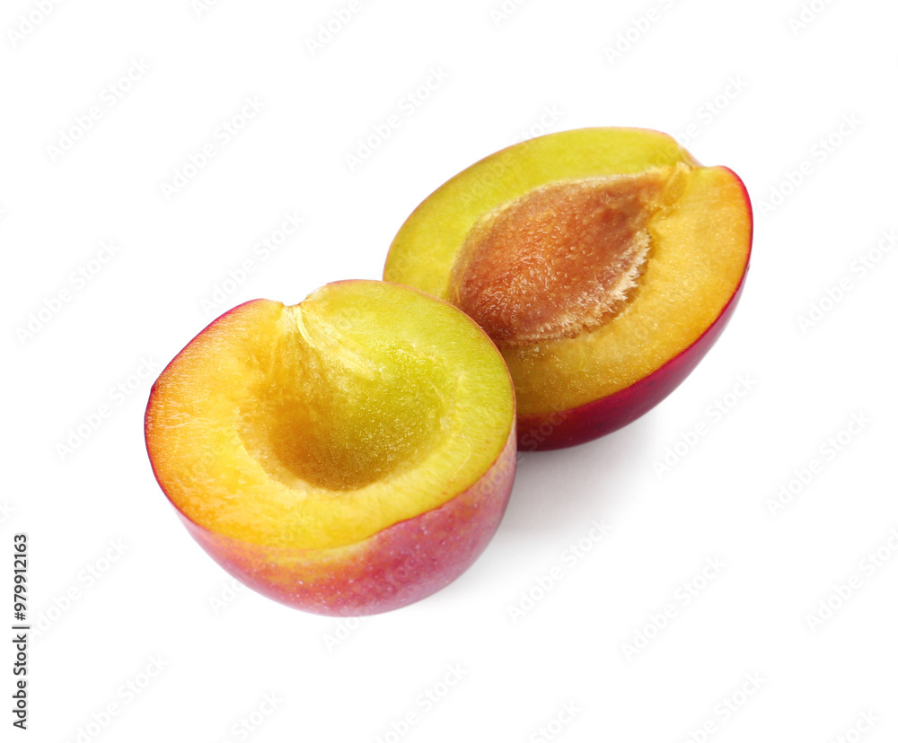 Halves of ripe plum isolated on white Halves of ripe plum isolated on white