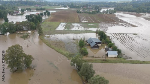 Wallpaper Mural Aerial shot of a village flooded by a river, with homes and fields submerged up to the first floor. Roads and farmland are underwater in this natural disaster. Torontodigital.ca