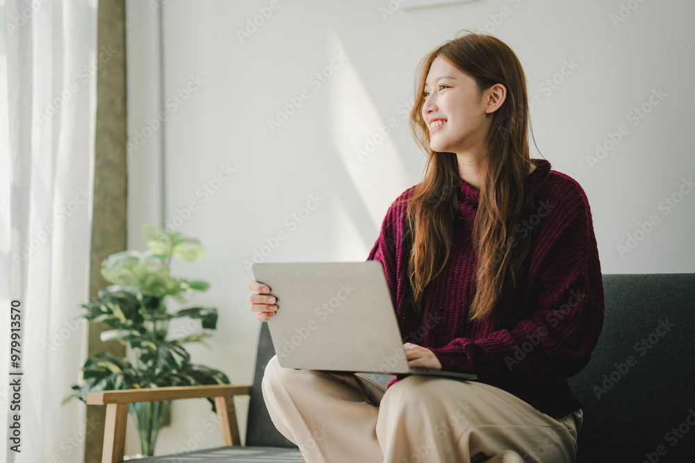 Smiling young woman uses social media to relax at home on the weekend. Relaxation concept Smiling young woman uses social media to relax at home on the weekend. Relaxation concept