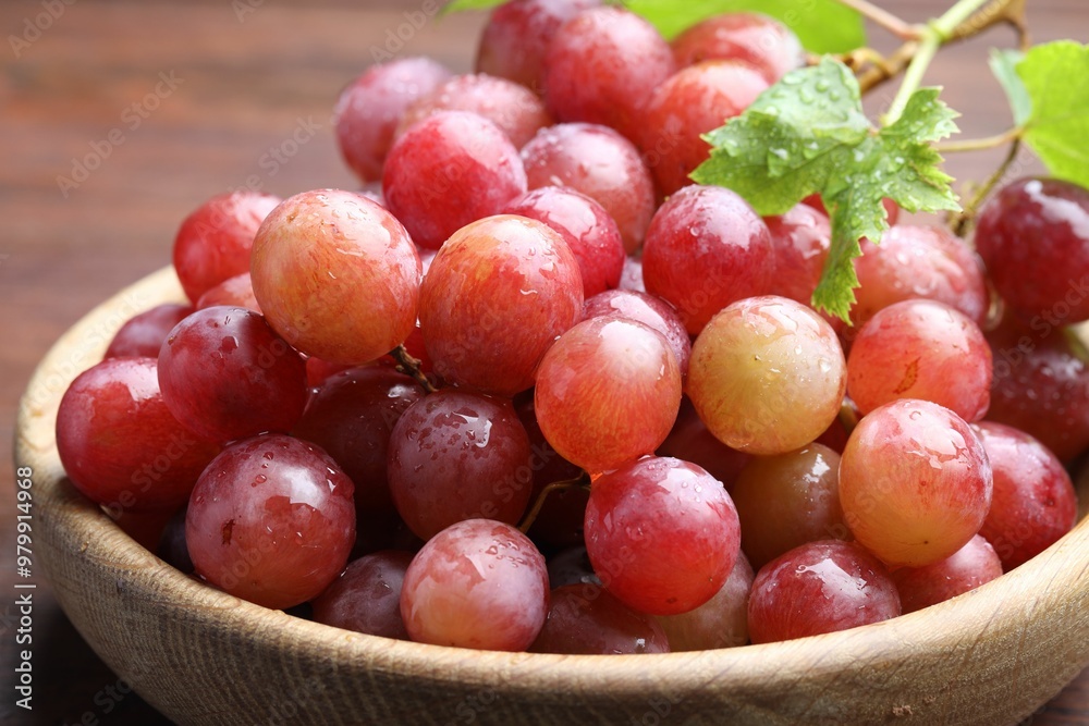Fresh ripe grapes on wooden table, closeup Fresh ripe grapes on wooden table, closeup