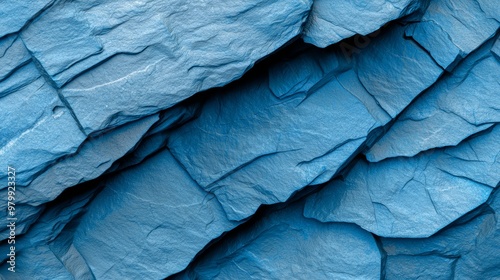 Wallpaper Mural  A tight shot of a rock formation with a painted blue marking on its visage and a central black object Torontodigital.ca