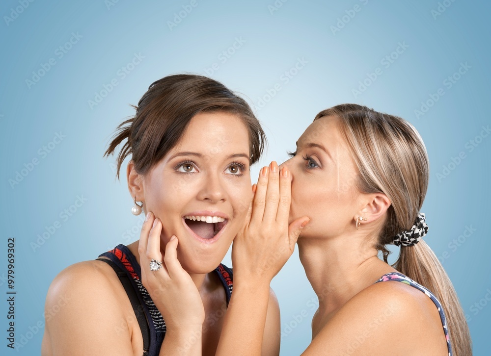 Handsome young friends sharing secret or gossip Handsome young friends sharing secret or gossip