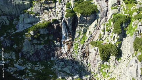 Aerial drone view of the Skok Waterfall cascading down rocky cliffs in the High Tatras photo