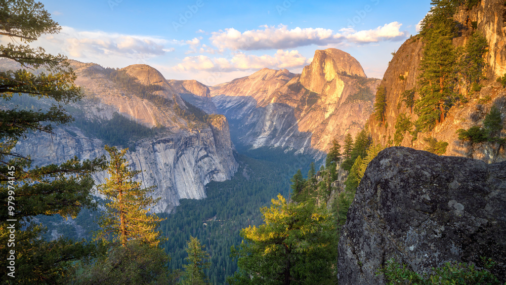 hiking the four mile trail at sunset in yosemite national park, california