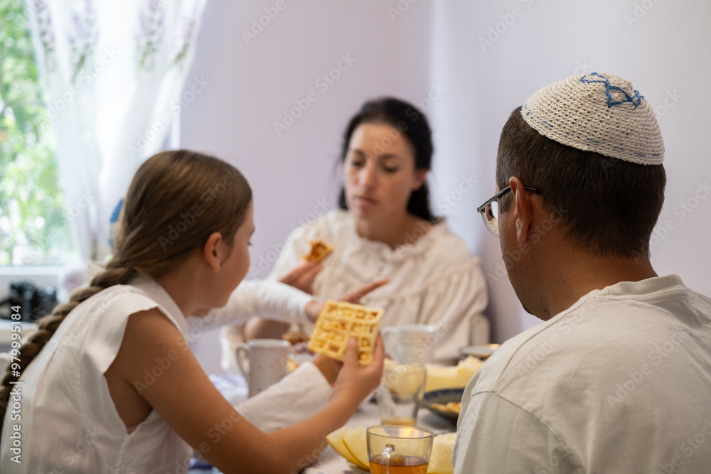 jewish family celebrating hanukkah, israel, boy in kippah, jewish holidays, yom kippur feast, table with food, honey, donuts, family holiday jewish family celebrating hanukkah, israel, boy in kippah, jewish holidays, yom kippur feast, table with food, honey, donuts, family holiday
