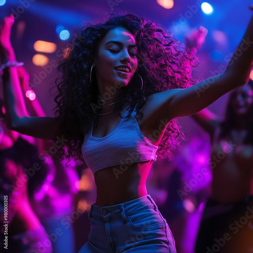 young woman dancing in a nightclub photo