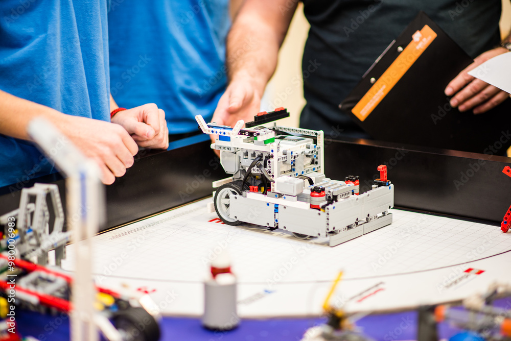 Obraz premium Zilina, Slovakia- dec 14. 2018: First Lego league FLL robots and objects from LEGO on the game table Space theme parts, characters, functional robots created by competing childrens to solve problems