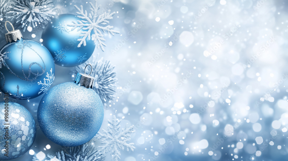 Silver background with blue Christmas ornaments and snowflakes, creating an elegant festive atmosphere. Sparkling lights for visual appeal. Perfect wallpaper or Christmas banner for holiday promotion.