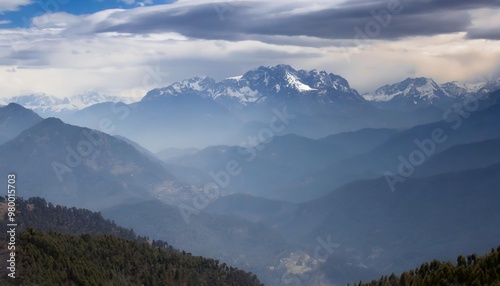 Majestic Mountain Range at Sunrise, Illuminating the Sky with Warm Colors