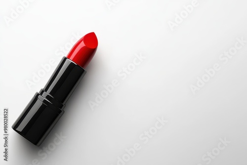 A solitary red lipstick against a white backdrop