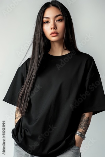 Stylish mockup of a plain black oversized t-shirt on a young woman, ideal for branding and design. Black T-shirt Mockup,Oversized Blank Shirt 