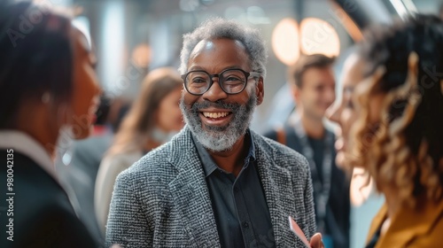 Confident and Charismatic Mature Businessman Wearing a Suit and Glasses Smiling and Greeting the with a Friendly Expression photo