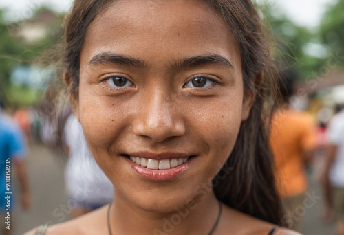 Close-up face, smiling, happy, eyes and mouth with white teeth, outside in summer, city streets, teenage girl or young woman, sunshine, shopping, lots of people, good mood