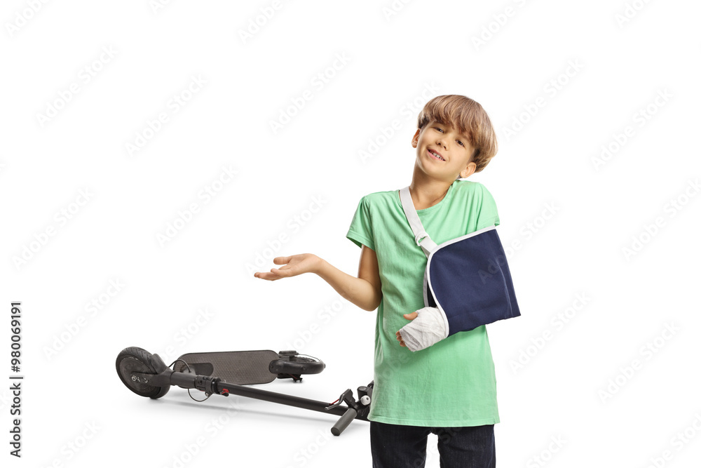 Boy with a broken arm wearing an arm splint, electric scooter injury concept Boy with a broken arm wearing an arm splint, electric scooter injury concept
