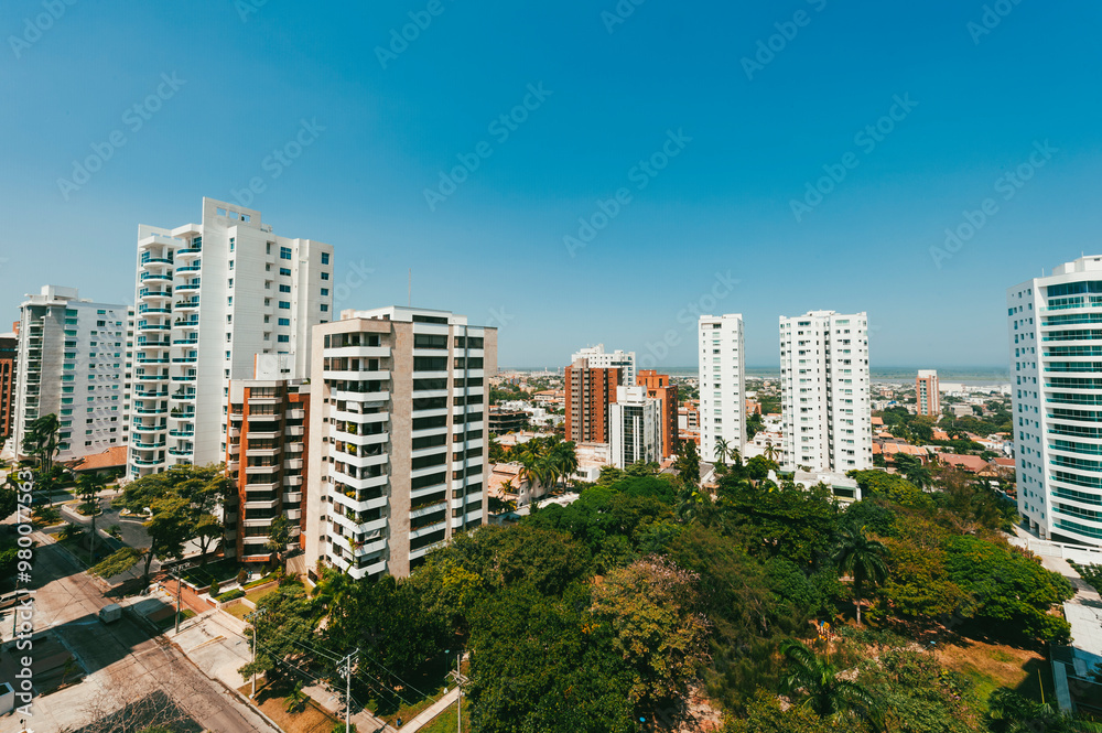 Cali, Colombia. January 7, 2011: panoramic landscape of the city with buildings and blue sky. Cali, Colombia. January 7, 2011: panoramic landscape of the city with buildings and blue sky.