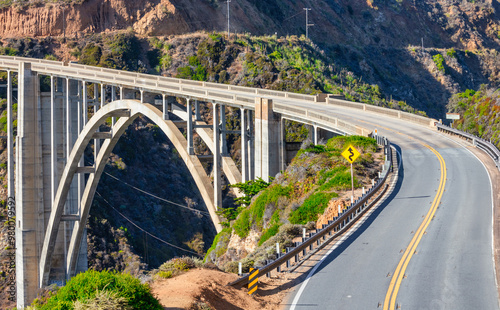 Beautiful scenery of Pacific Ocean coast along Highway 1 and Big Sur, wonderful aerial view of Bixby Bridge, sunset, sunrise, fog. Concept, travel, vacation, weekend photo