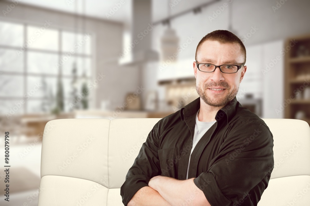 Happy man relaxing in room at home. Happy man relaxing in room at home.