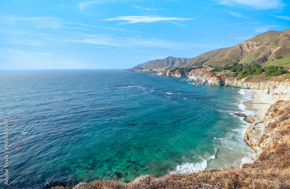 Fototapeta premium Beautiful landscape of Pacific Ocean coast along Highway 1 and Big Sur, aerial view, sunset, sunrise, fog. Concept, travel, vacation, weekend