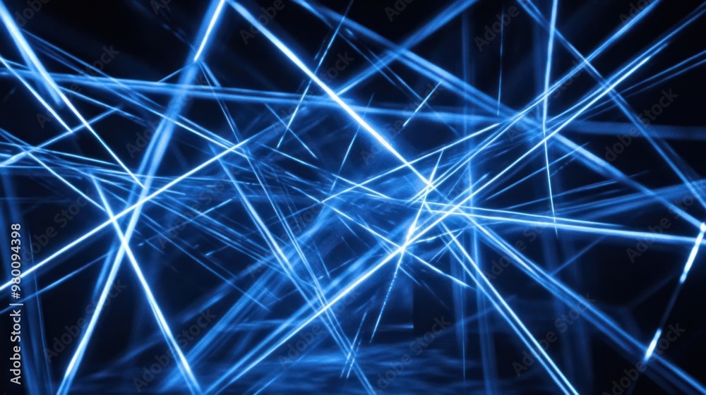 A series of thin blue light beams intersecting, creating an intricate web-like pattern against a dark background. A series of thin blue light beams intersecting, creating an intricate web-like pattern against a dark background.