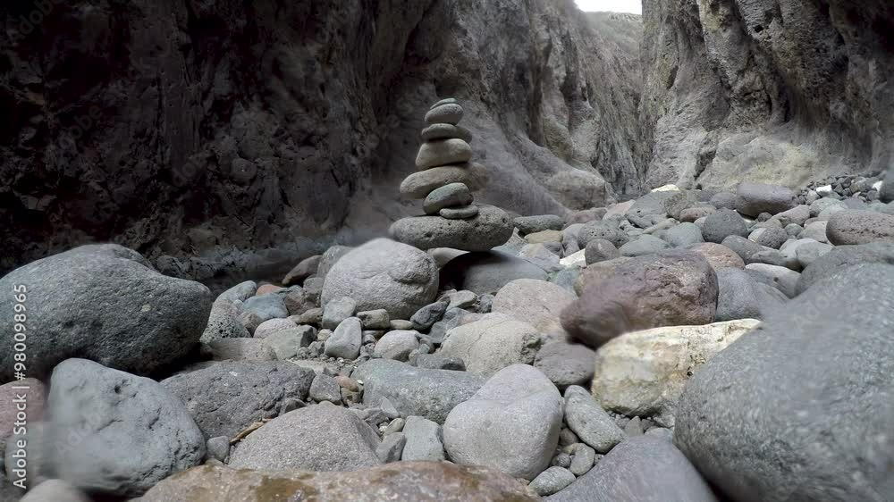 Stones stacked on each other on a riverbed in Somoto Canyon Stones stacked on each other on a riverbed in Somoto Canyon