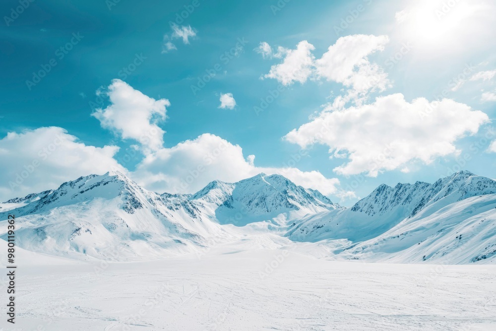 Snow-capped Mountains under a Blue Sky with White Clouds Snow-capped Mountains under a Blue Sky with White Clouds