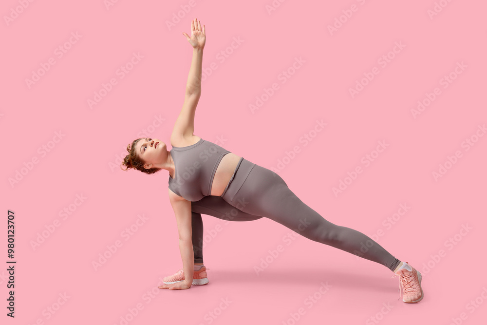Sporty young woman doing yoga on pink background Sporty young woman doing yoga on pink background