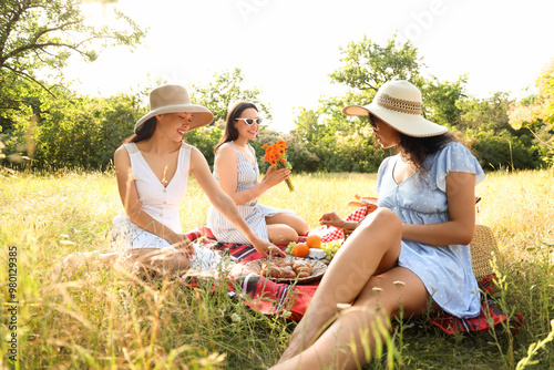 Happy female friends with f...