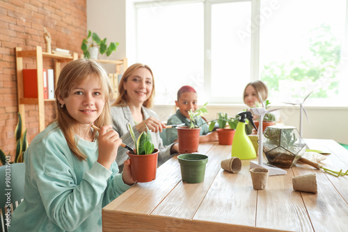 Female teacher and pupils p...