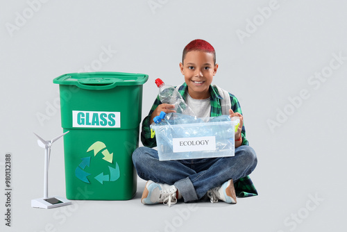 Teenage boy with garbage co...