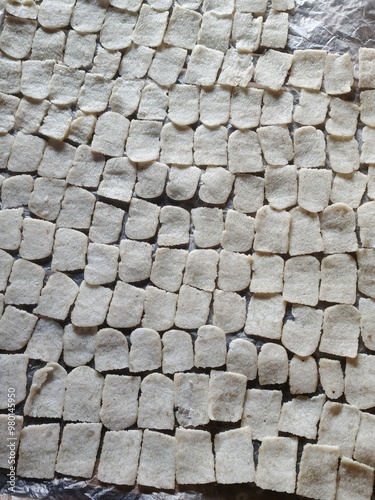 Rice crackers that are still wet are about to be dried in the sun photo