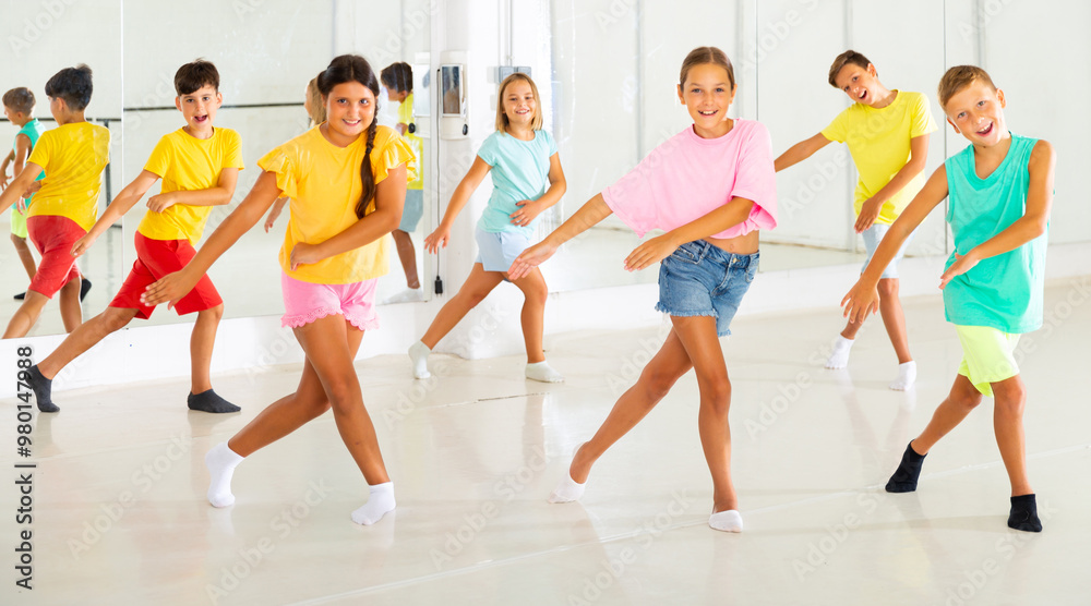 Fototapeta premium Children studying modern style dances in dance class indoors