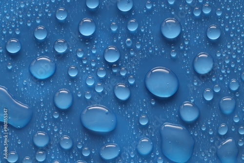 Water drops on blue background, above view